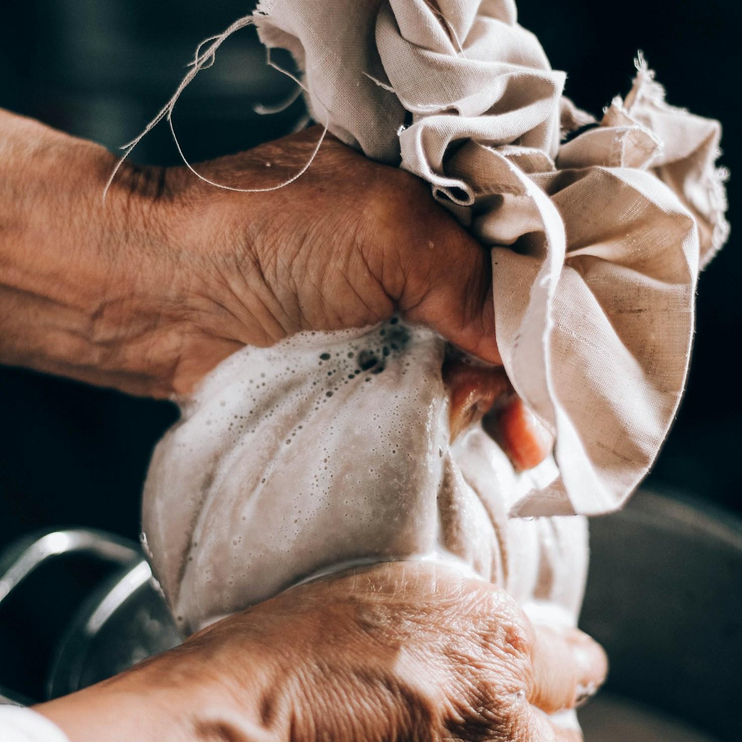 Community members collaborating in a contemporary kitchen, sharing recipes and cooking techniques